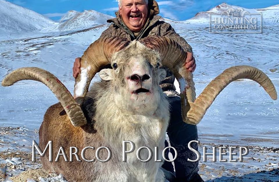 A picture of a happy hunter depicting successful marco polo sheep hunting trophy