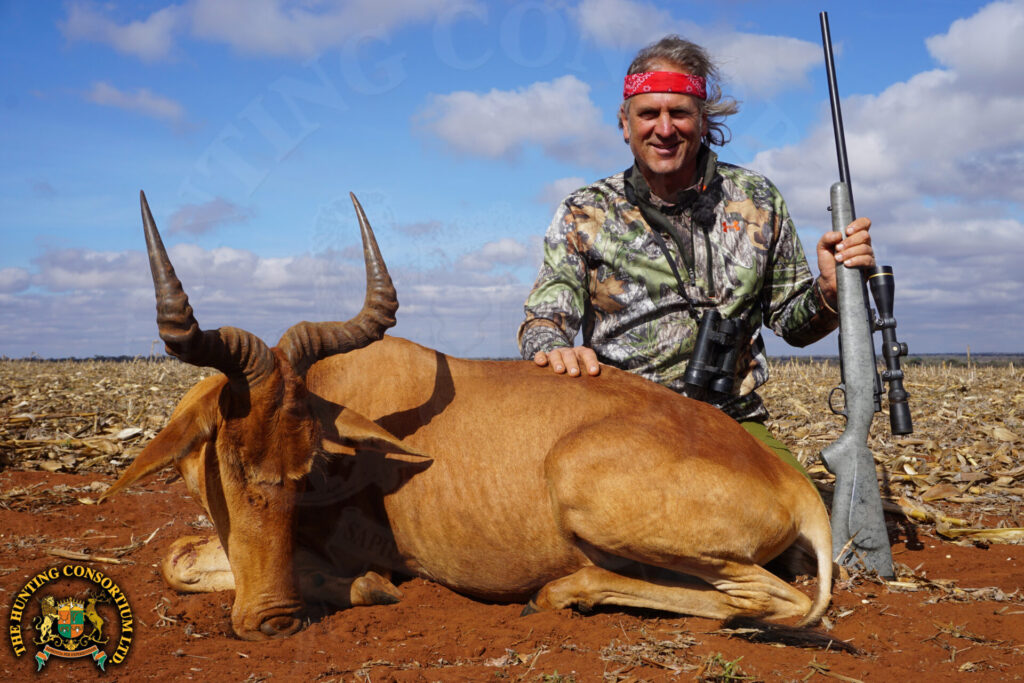 Photo of Jim Shockey with his Coke's hartebeest hunting in Tanzania.